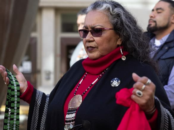 Mary Tarango leads a prayer at a press conference about a land acknowledgement for city council meetings outside Sacramento City Hall, Tuesday, Dec. 14, 2021. Photo Courtesy of Andrew Nixon, CapRadio.